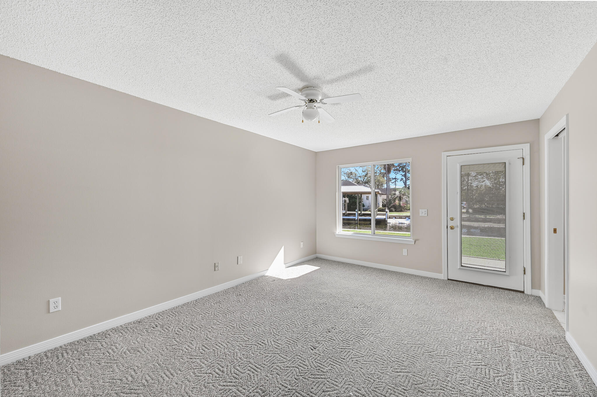 292 West Harborview Road Santa Rosa Beach, FL 32459 - Photo 21 of 43 an empty room with windows and closet