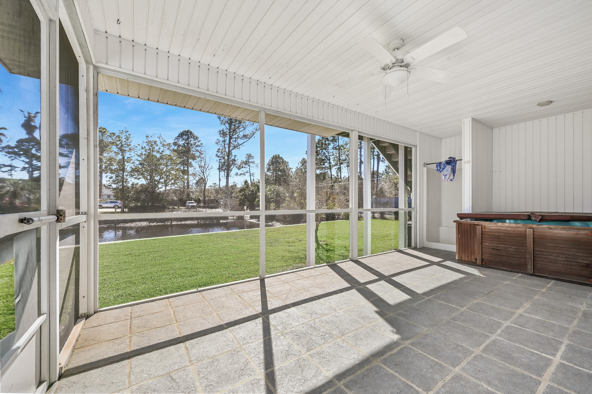 292 West Harborview Road Santa Rosa Beach, FL 32459 - Photo 23 of 43 a living room with a large window and a rug