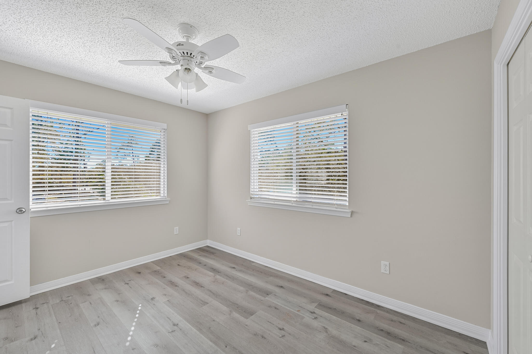 292 West Harborview Road Santa Rosa Beach, FL 32459 - Photo 31 of 43 a view of an empty room with wooden floor and a window