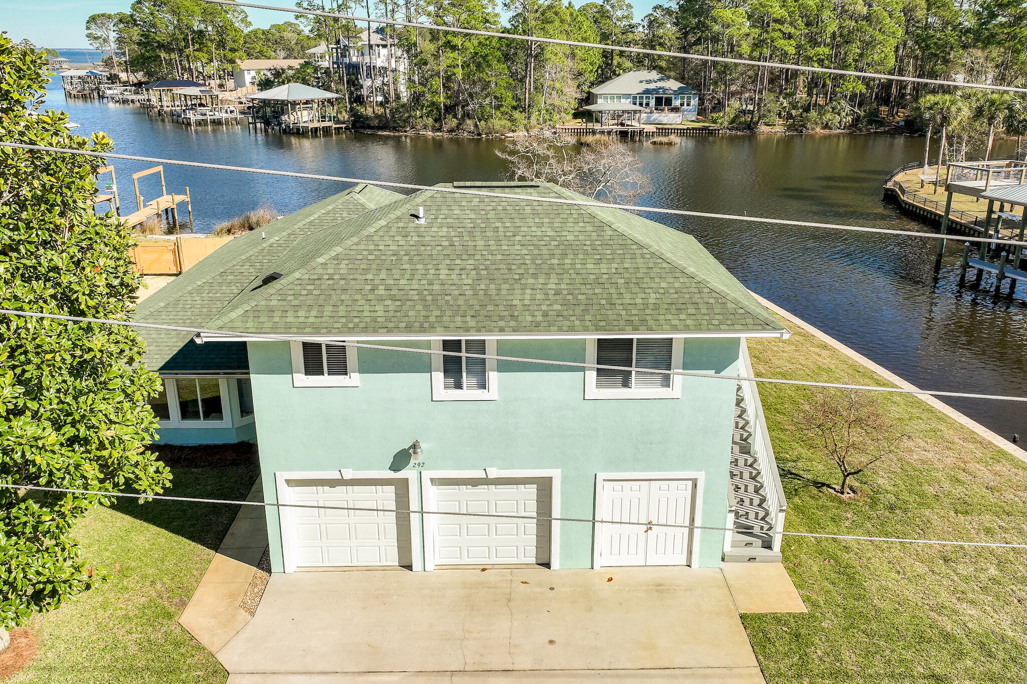 292 West Harborview Road Santa Rosa Beach, FL 32459 - Photo 32 of 43 a house with river in front of it