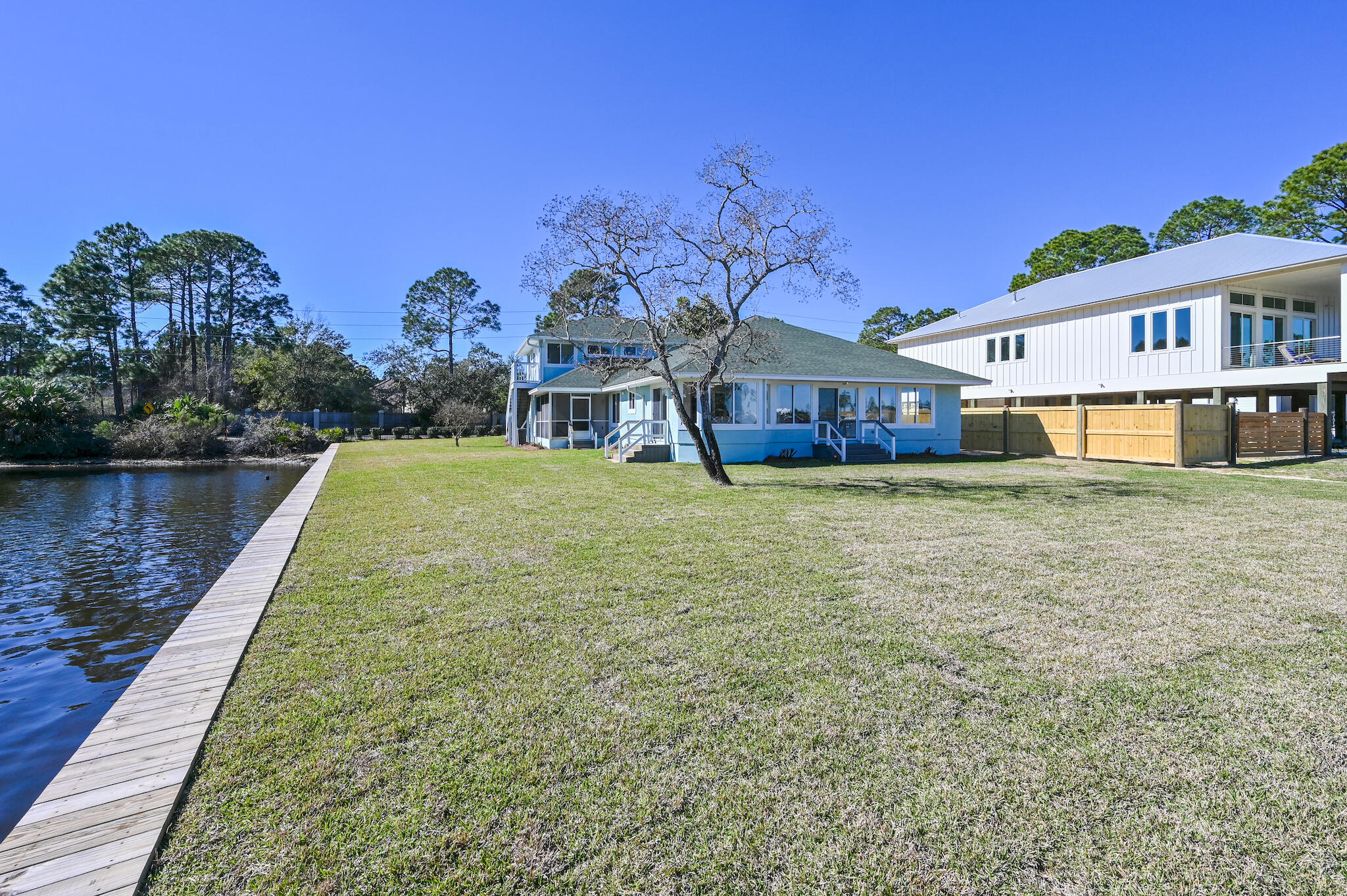 292 West Harborview Road Santa Rosa Beach, FL 32459 - Photo 42 of 43 a view of a house with a yard