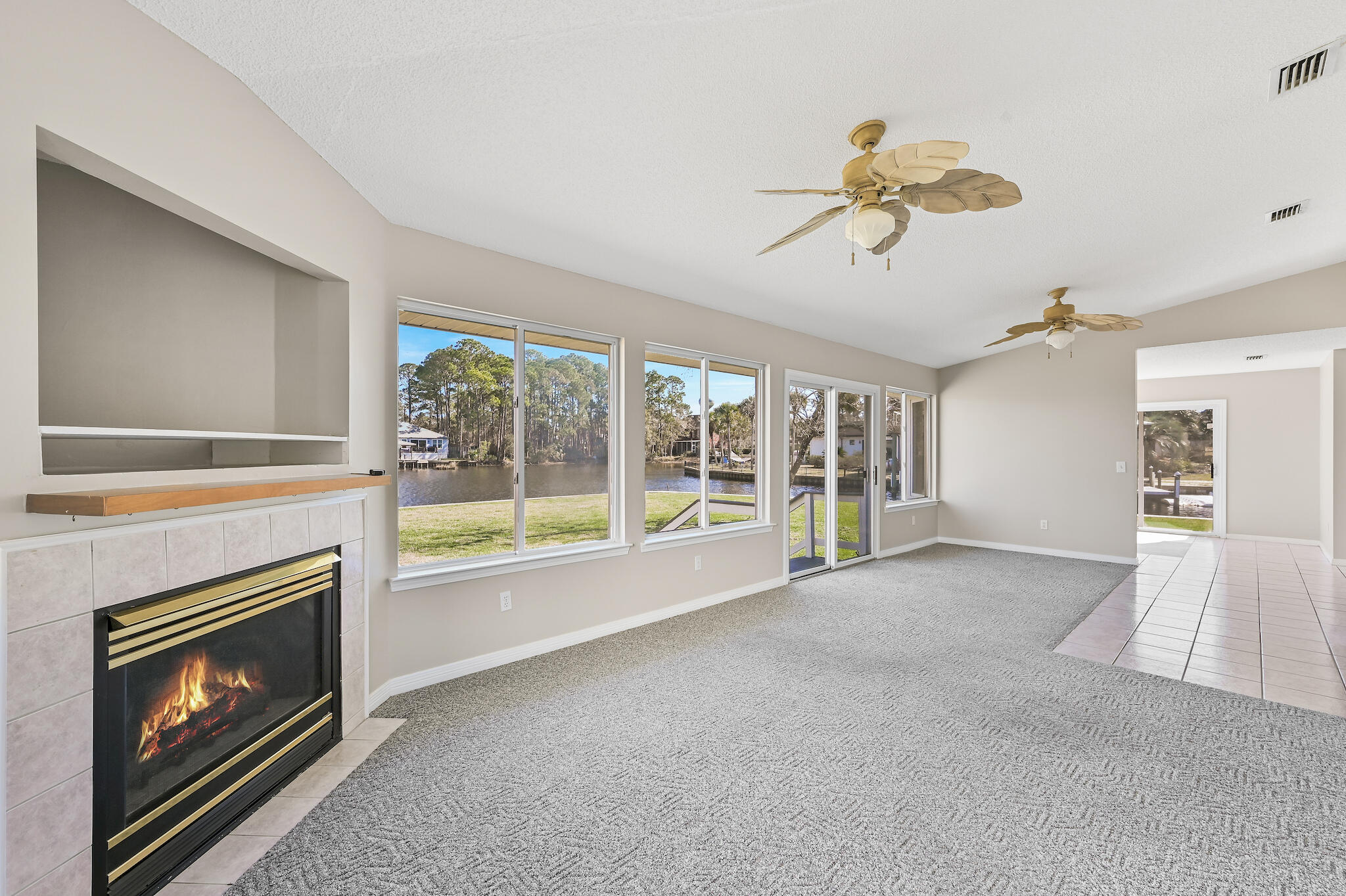 292 West Harborview Road Santa Rosa Beach, FL 32459 - Photo 5 of 43 a living room with furniture and a fireplace