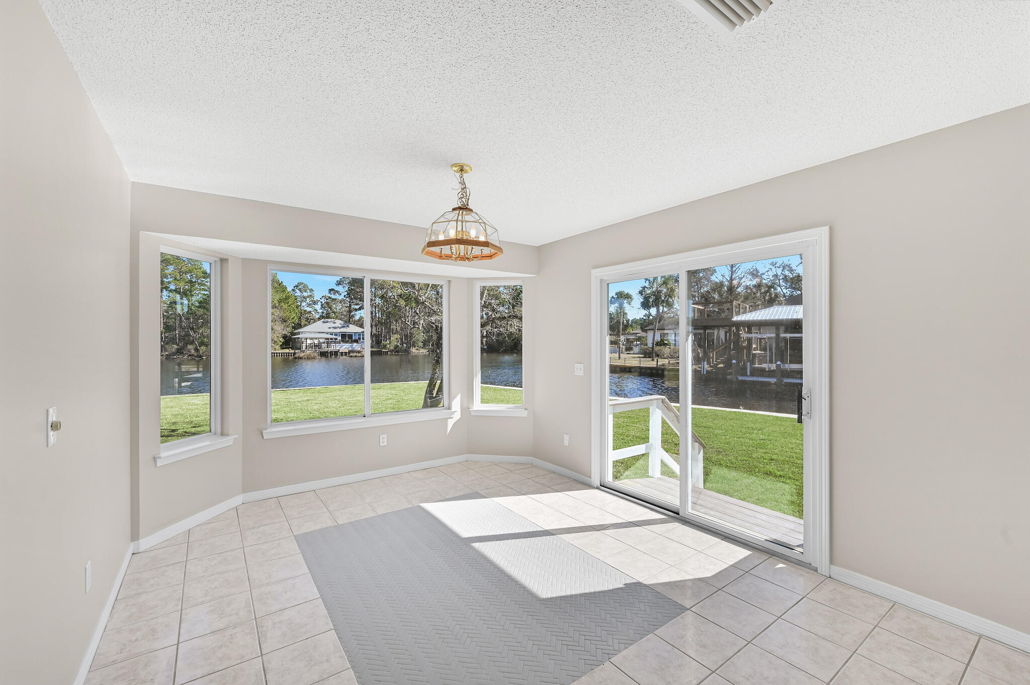 292 West Harborview Road Santa Rosa Beach, FL 32459 - Photo 10 of 43 a view of an empty room with windows
