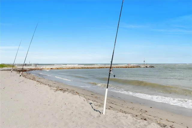 a view of a lake with houses in the back