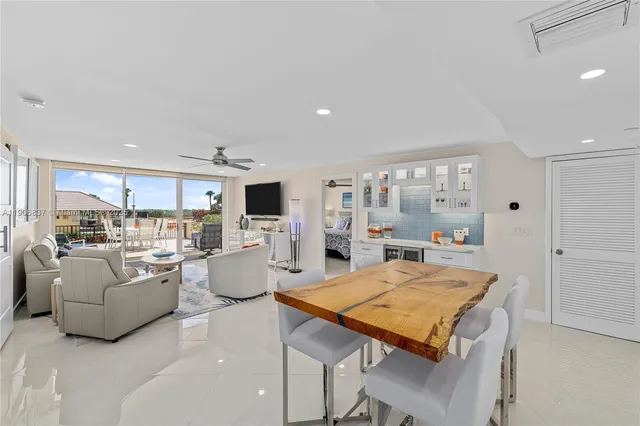 a living room with kitchen island furniture and a table