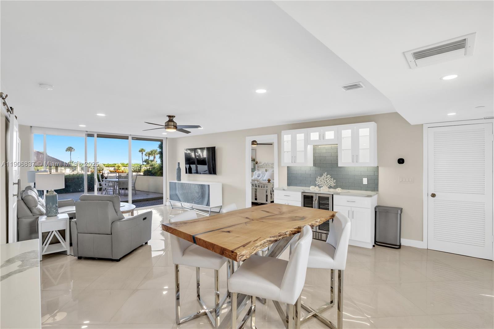 300 Ocean Trail Way, Unit 108 Jupiter, FL 33477 - Photo 5 of 21 a view of a dining room with furniture