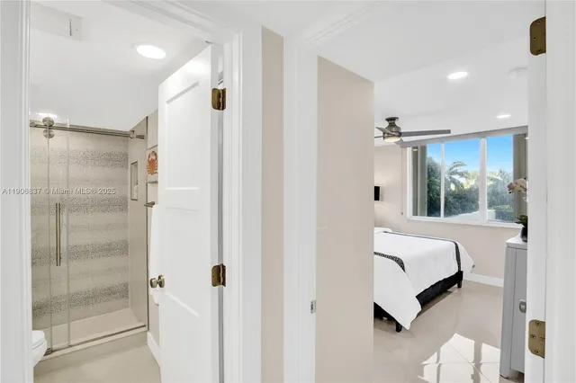 a bedroom with a bed and a mirror