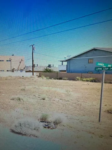a kitchen with kitchen island sink refrigerator and cabinets