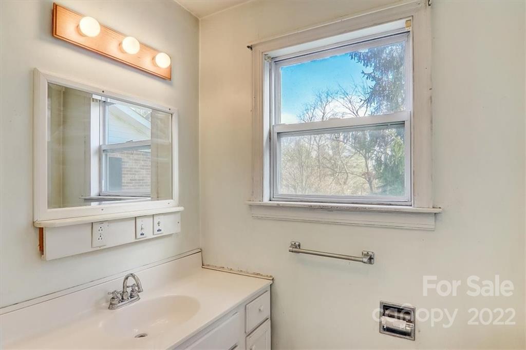 121 Edwards Road Clyde, NC 28721 - Photo 26 of 48 a bathroom with a sink and a window