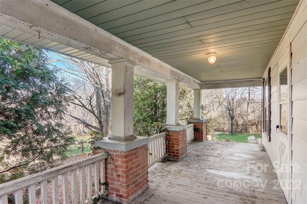 121 Edwards Road Clyde, NC 28721 - Photo 7 of 48 a porch with view of outdoor space