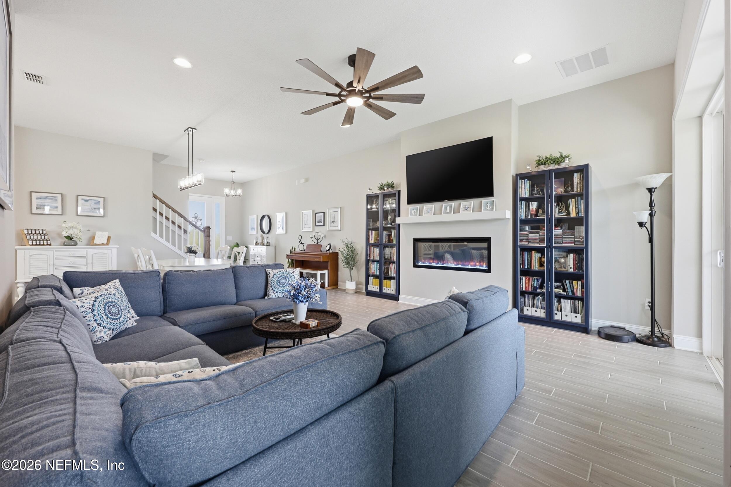 439 Rum Runner Way St. Johns, FL 32259 - Photo 13 of 82 a living room with furniture and a flat screen tv