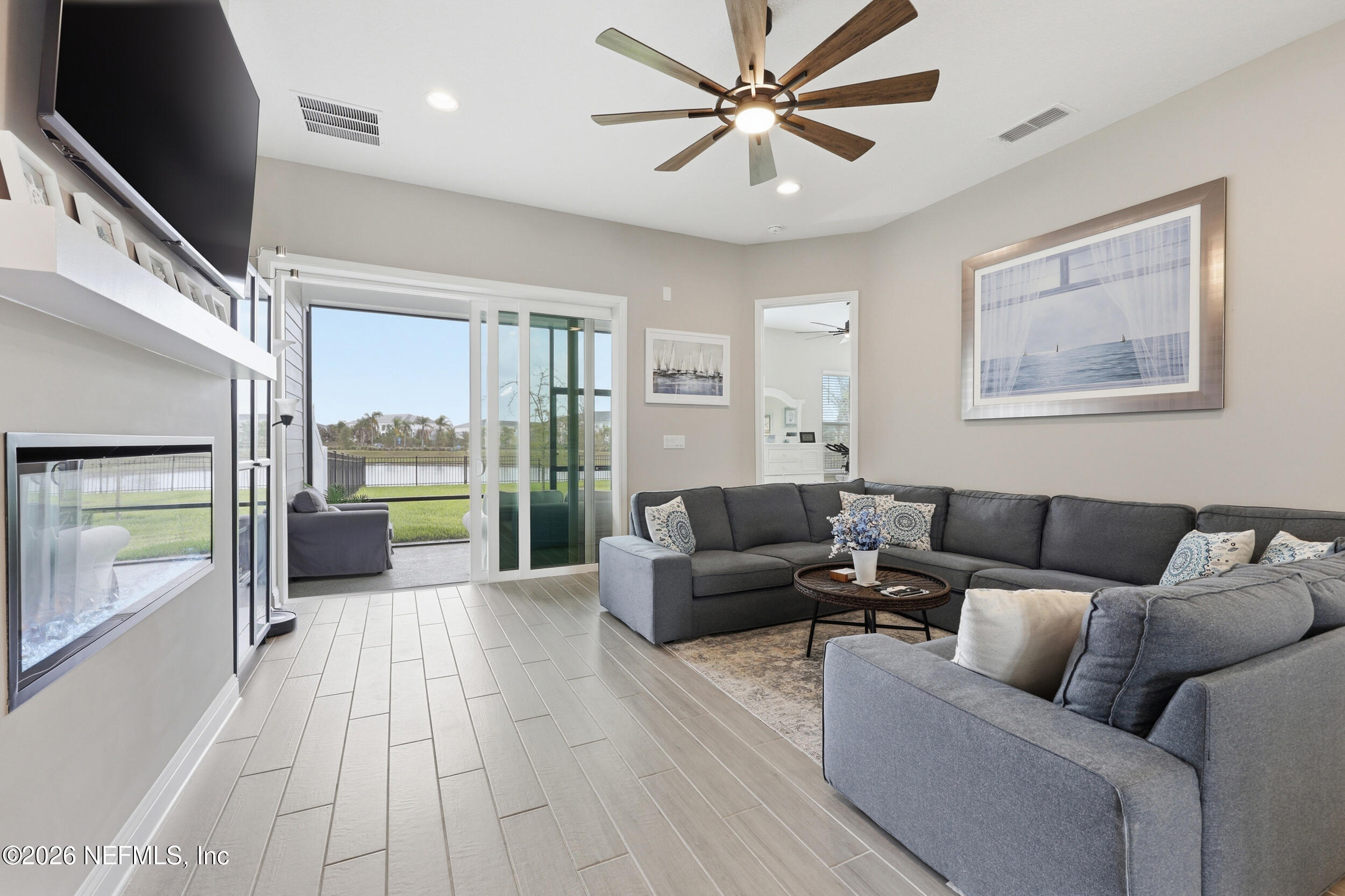 439 Rum Runner Way St. Johns, FL 32259 - Photo 14 of 82 a living room with furniture and a large window