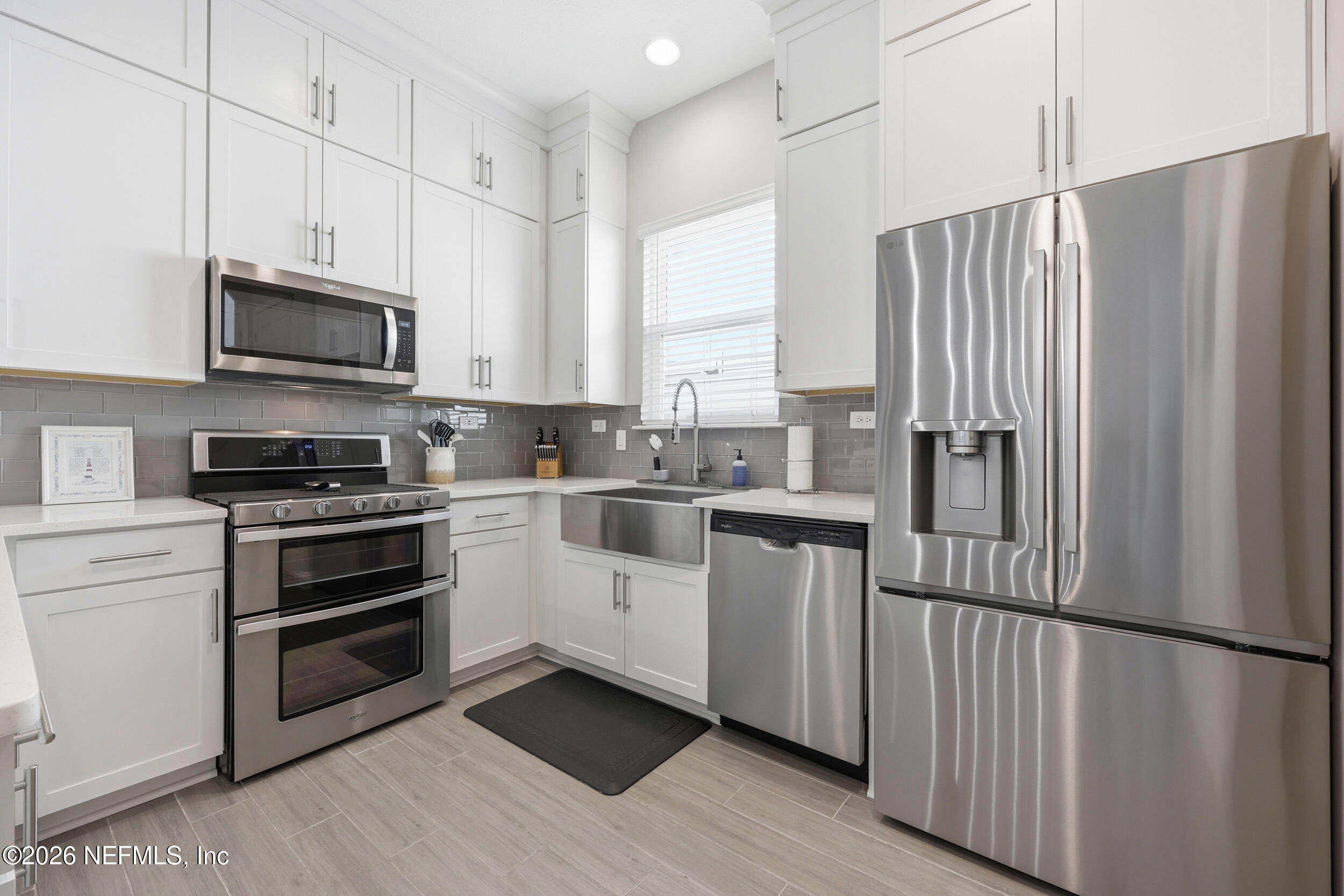 439 Rum Runner Way St. Johns, FL 32259 - Photo 18 of 82 a kitchen with stainless steel appliances a refrigerator sink and microwave