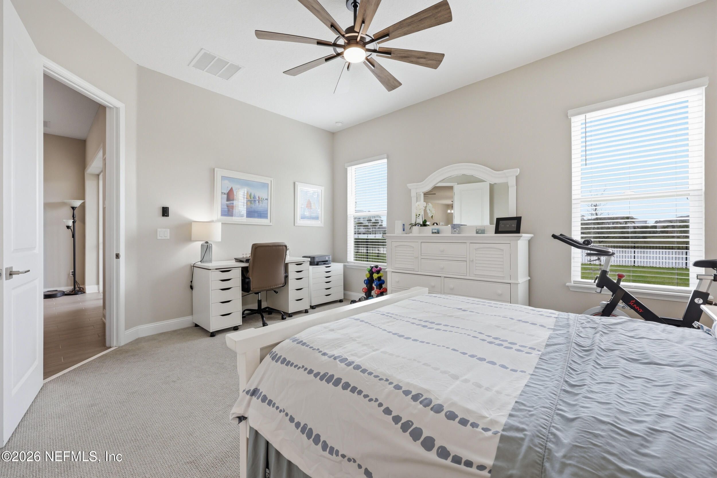 439 Rum Runner Way St. Johns, FL 32259 - Photo 24 of 82 a bedroom with a bed and a chandelier