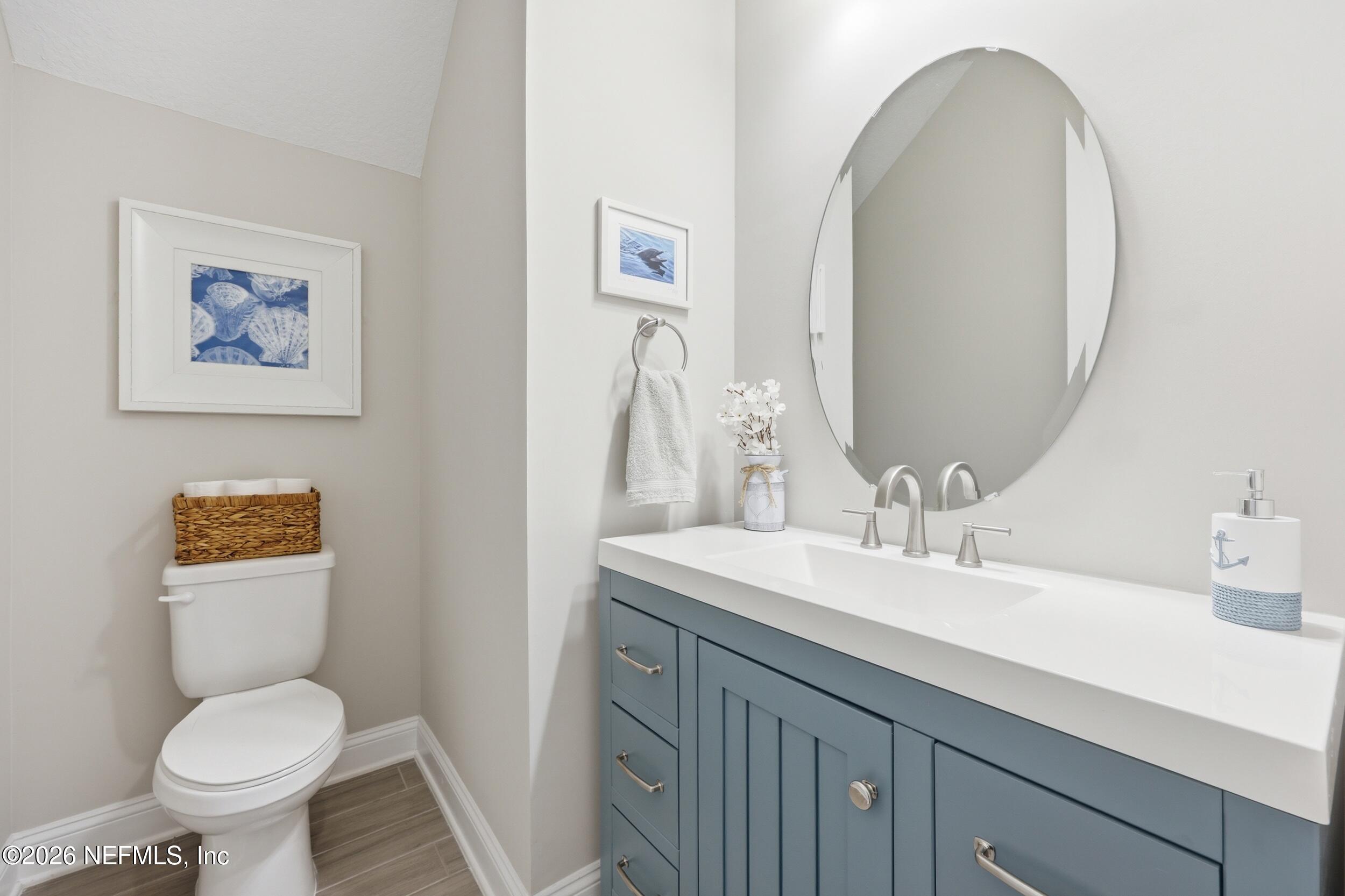 439 Rum Runner Way St. Johns, FL 32259 - Photo 29 of 82 a bathroom with a toilet sink and mirror