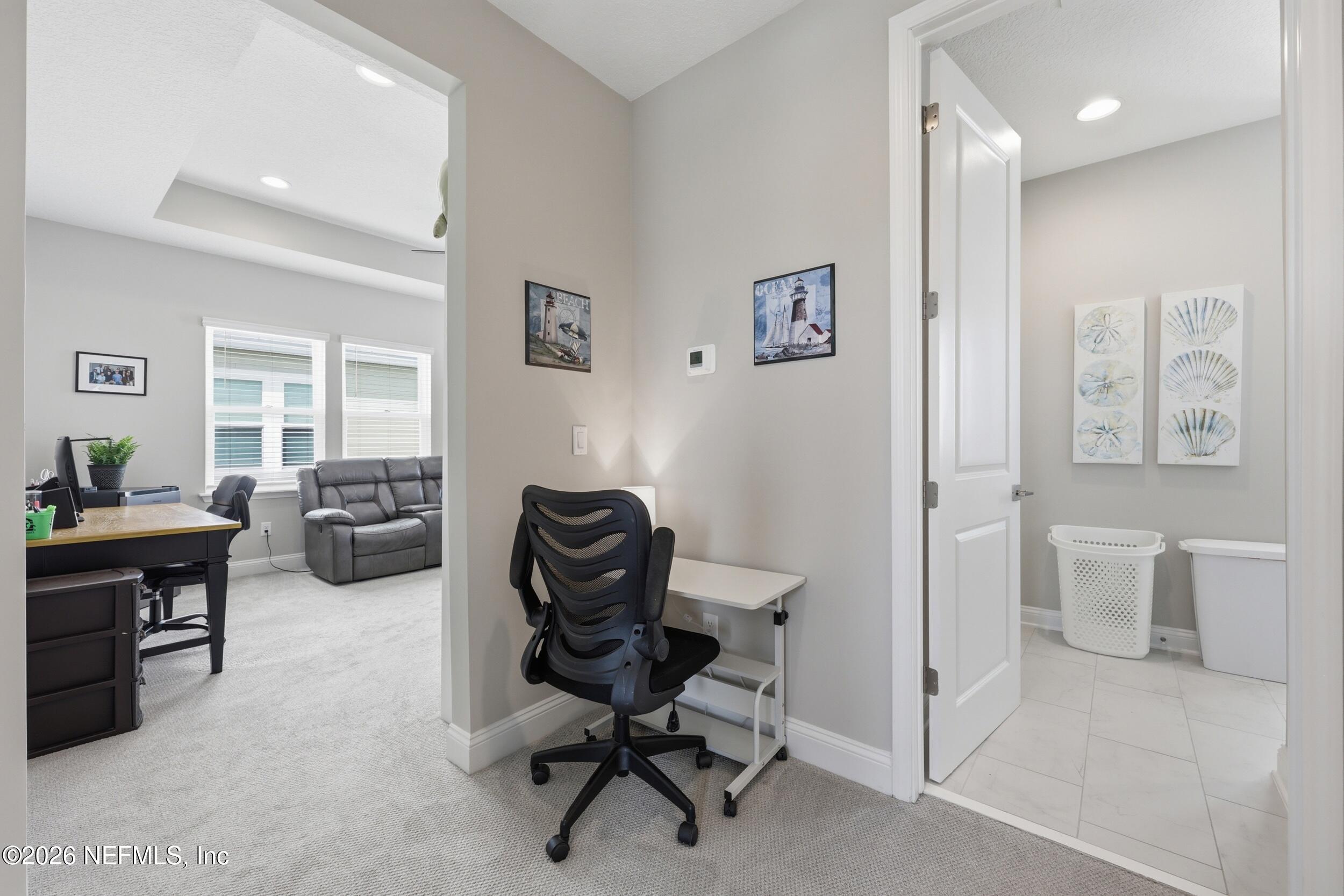 439 Rum Runner Way St. Johns, FL 32259 - Photo 34 of 82 a view of a workspace with furniture and a livingroom