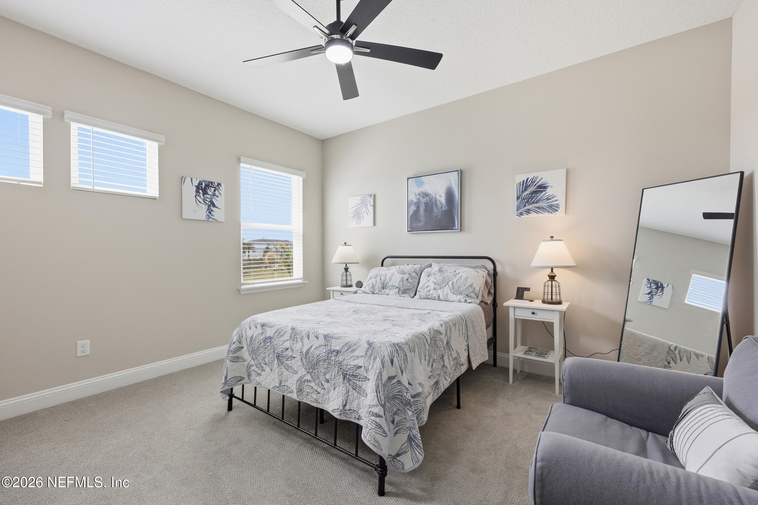 439 Rum Runner Way St. Johns, FL 32259 - Photo 35 of 82 a bed room with a bed and a couch