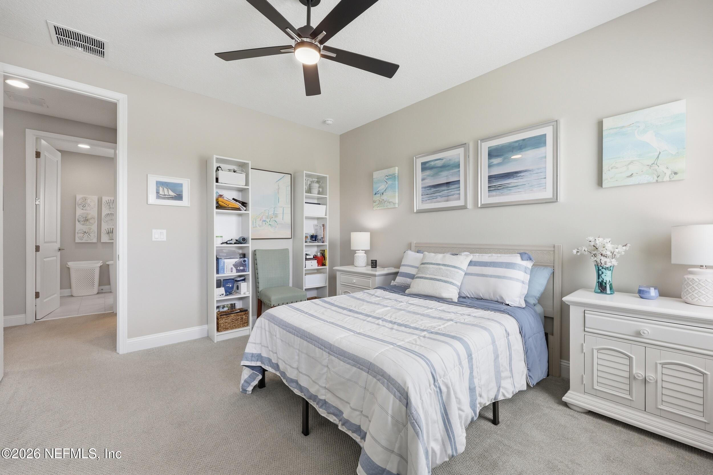 439 Rum Runner Way St. Johns, FL 32259 - Photo 39 of 82 a spacious bedroom with a bed and a cabinets