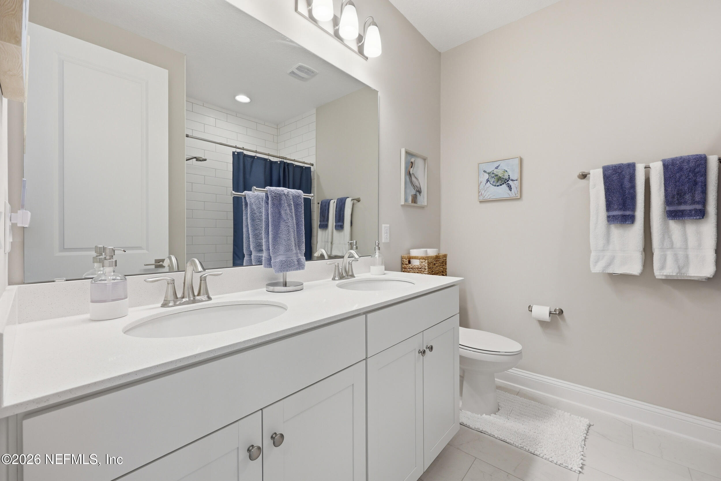 439 Rum Runner Way St. Johns, FL 32259 - Photo 41 of 82 a bathroom with a toilet sink double vanity and mirror