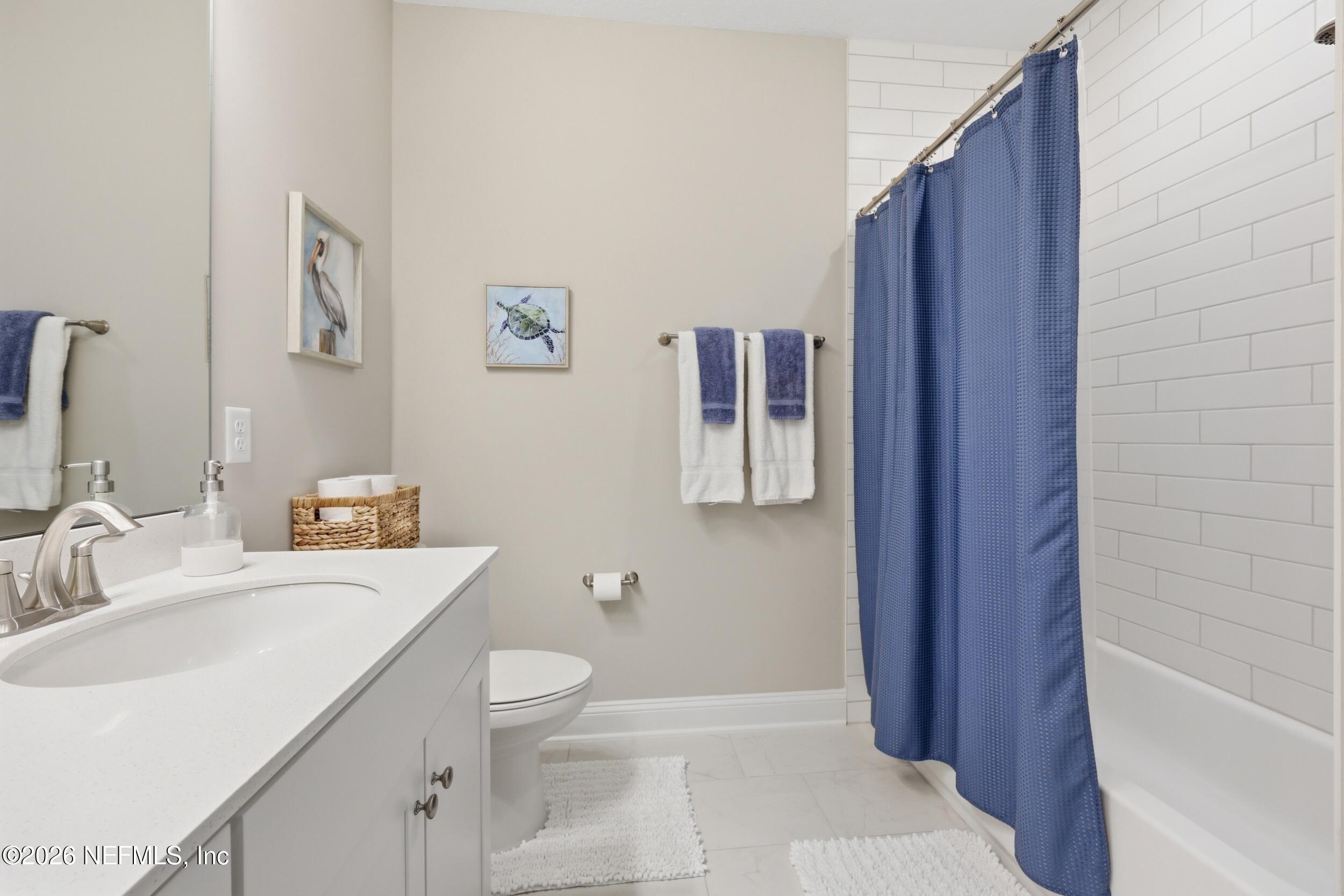 439 Rum Runner Way St. Johns, FL 32259 - Photo 42 of 82 a bathroom with a sink a toilet and shower