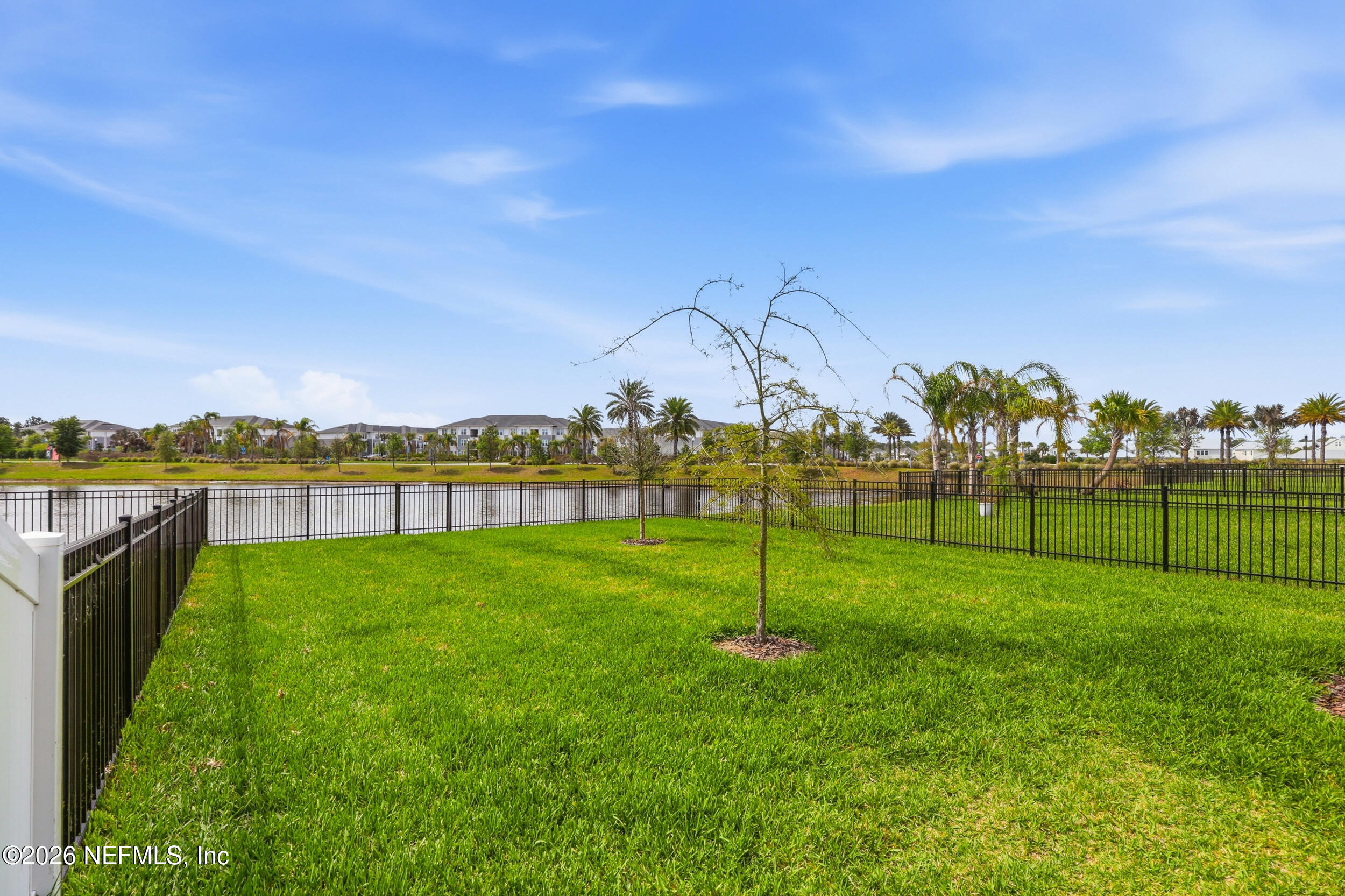 439 Rum Runner Way St. Johns, FL 32259 - Photo 53 of 82 a view of a golf course with a lake