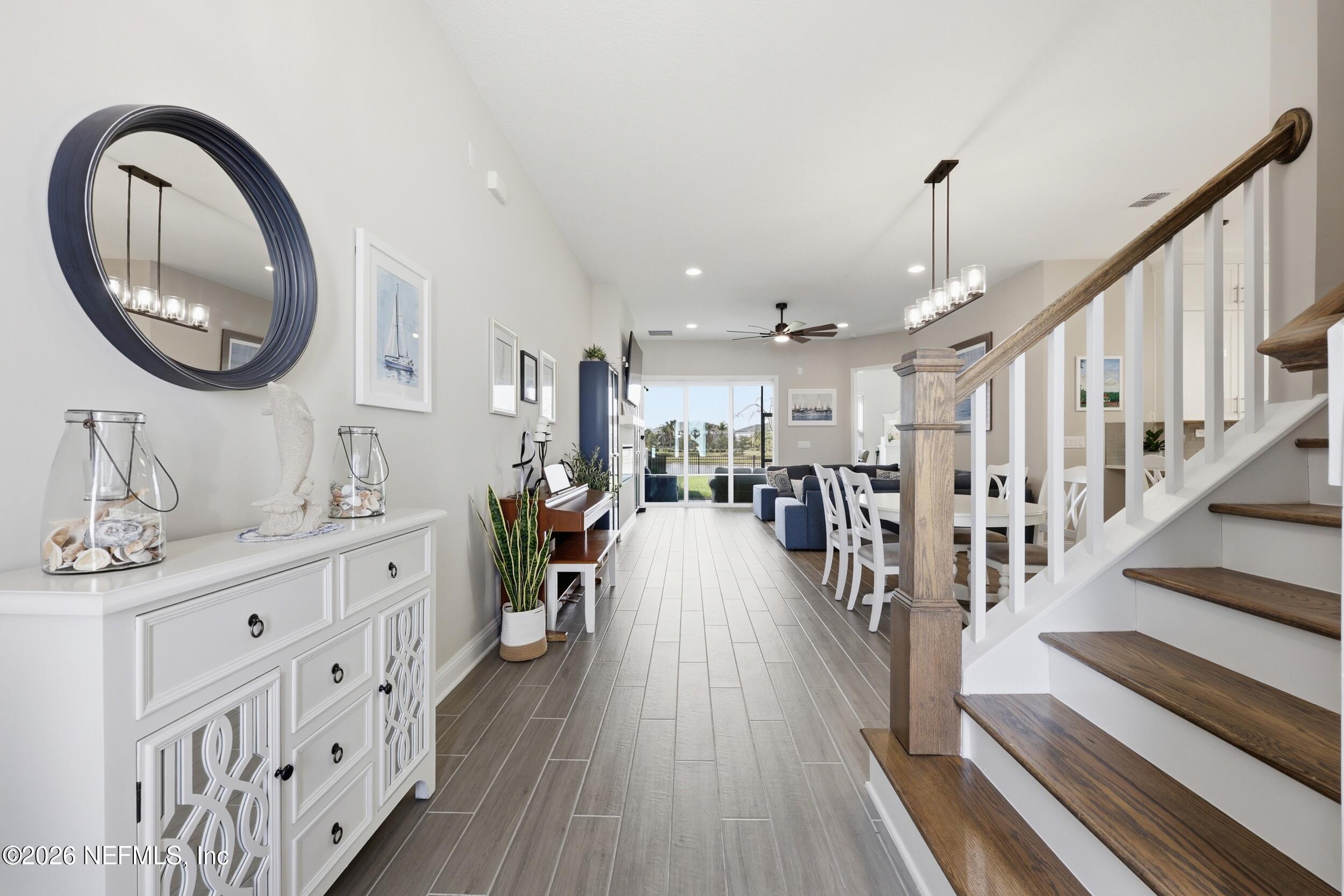 439 Rum Runner Way St. Johns, FL 32259 - Photo 6 of 82 a very nice looking room with wooden floor and a view of staircase