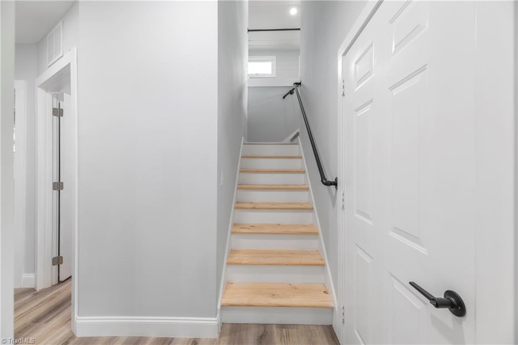475 Timber Ridge Road Kernersville, NC 27284 - Photo 32 of 43 Stairwell to upper level. These stairs are now stained gray.