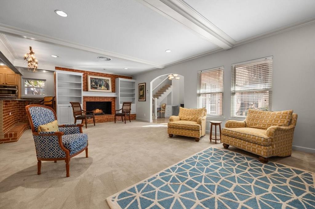 1929 Berkeley Place Fort Worth, TX 76110 - Photo 12 of 34 a living room with furniture and a fireplace