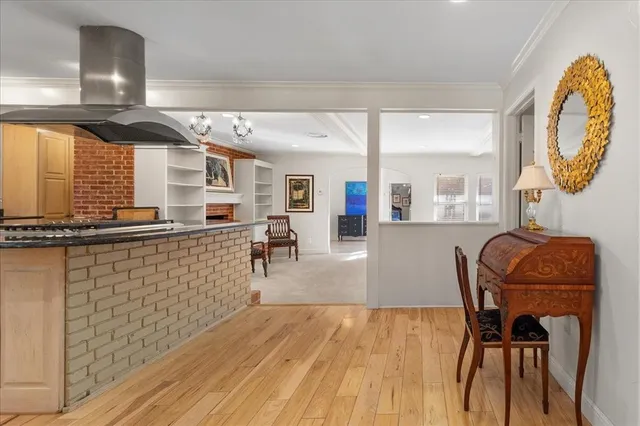 a dining room with furniture and a mirror