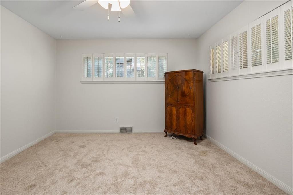 1929 Berkeley Place Fort Worth, TX 76110 - Photo 22 of 34 an empty room with windows