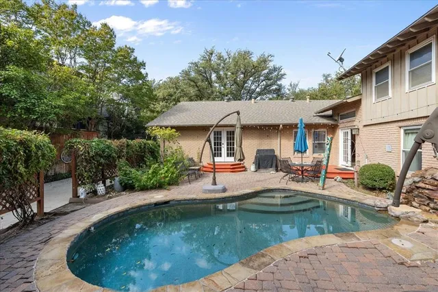a view of a livingroom with furniture and a window