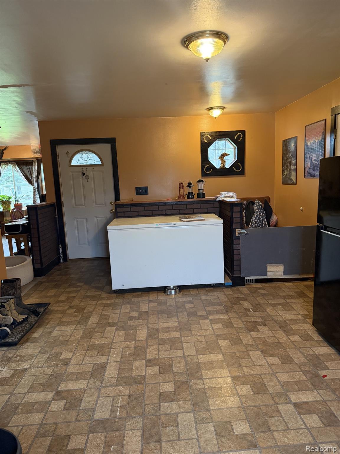 5200 Mayville Road Clifford, MI 48727 - Photo 7 of 17 Living area with brick patterned flooring