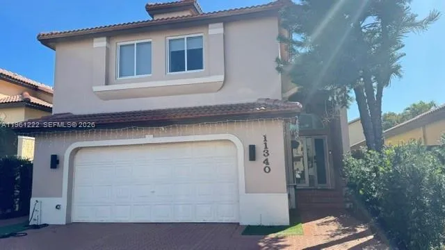 a bedroom with a bed and a night stand