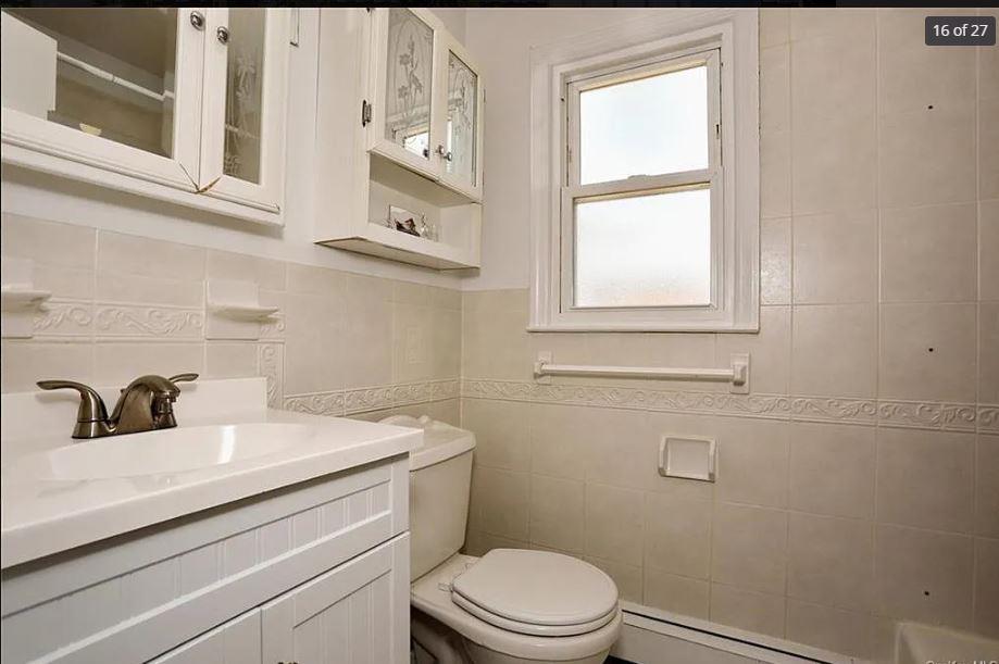 6 Schevchenko Place Spring Valley, NY 10977 - Photo 13 of 21 a bathroom with a sink a toilet and window