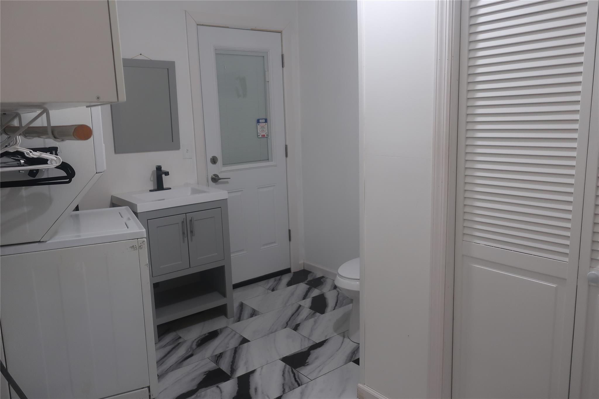 6 Schevchenko Place Spring Valley, NY 10977 - Photo 19 of 21 a bathroom with a sink toilet and vanity