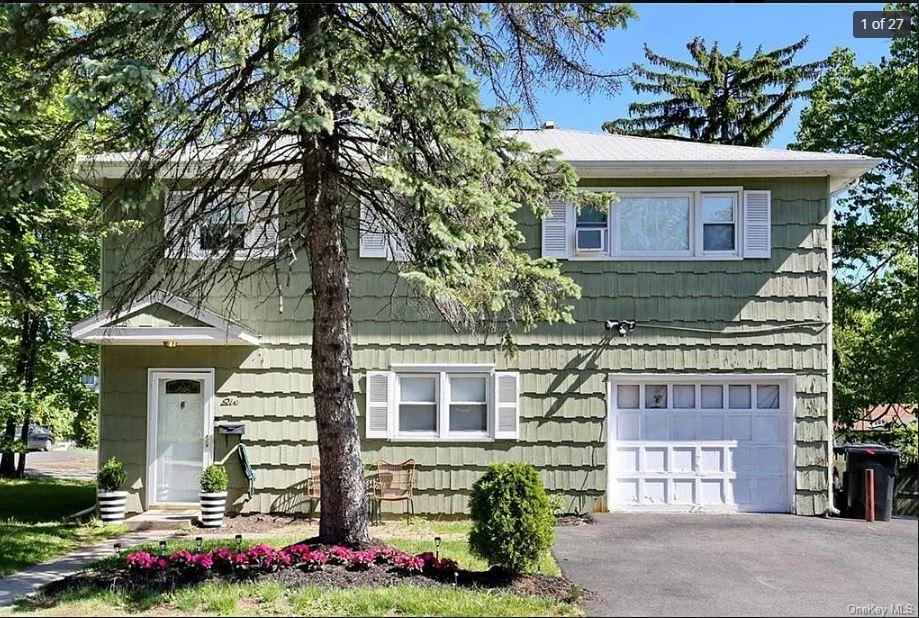 6 Schevchenko Place Spring Valley, NY 10977 - Photo 2 of 21 a front view of a house with a yard