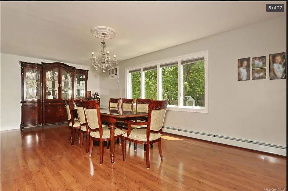 6 Schevchenko Place Spring Valley, NY 10977 - Photo 8 of 21 a view of a dining room with furniture window and wooden floor