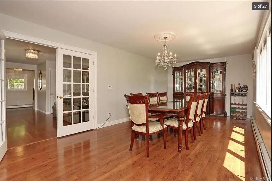 6 Schevchenko Place Spring Valley, NY 10977 - Photo 9 of 21 a view of a dining room with furniture and wooden floor