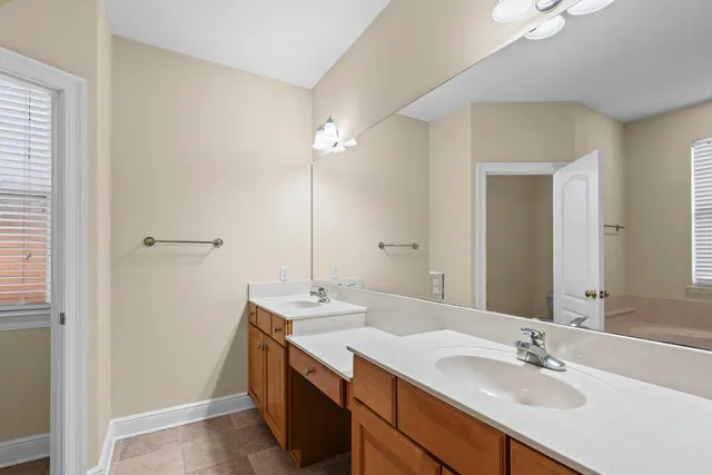 a bathroom with a sink a vanity and a mirror