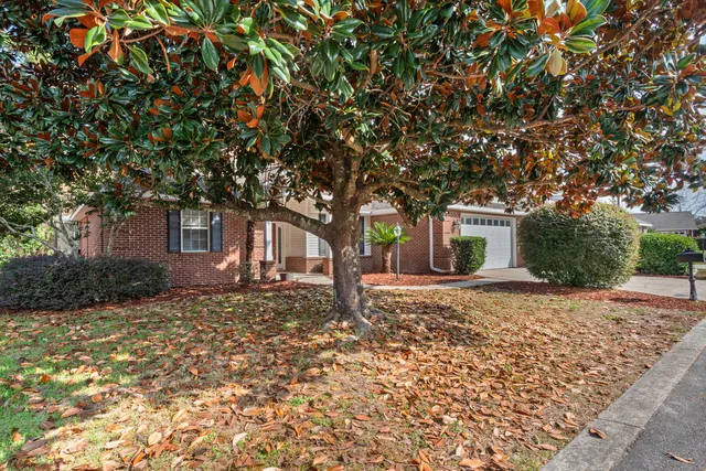 a house with trees in front of it