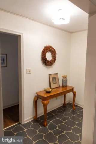 a view of a room with a table and chairs