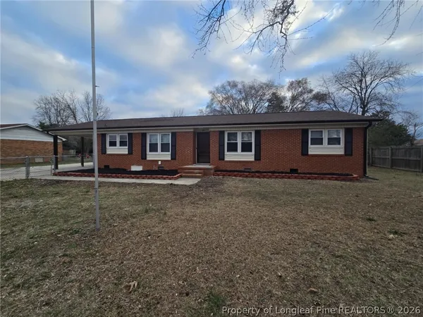 a view of house with yard and entertaining space