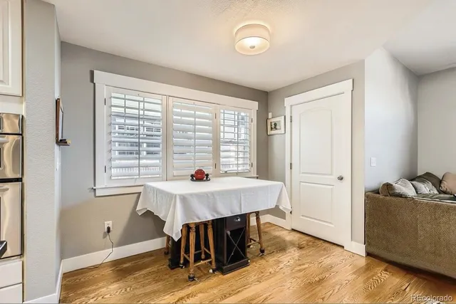 a view of a dining room with furniture window and wooden floor