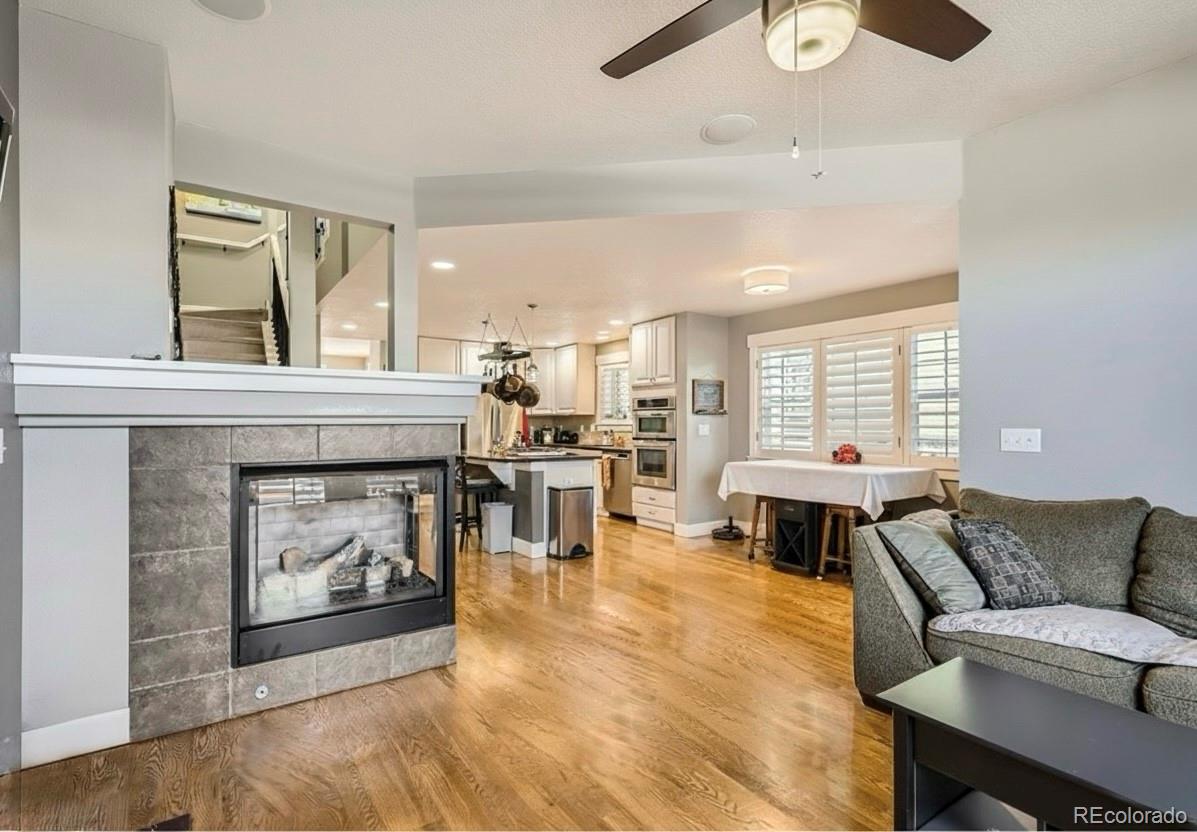 1145 South Logan Street Denver, CO 80210 - Photo 8 of 21 a living room with furniture and a fireplace