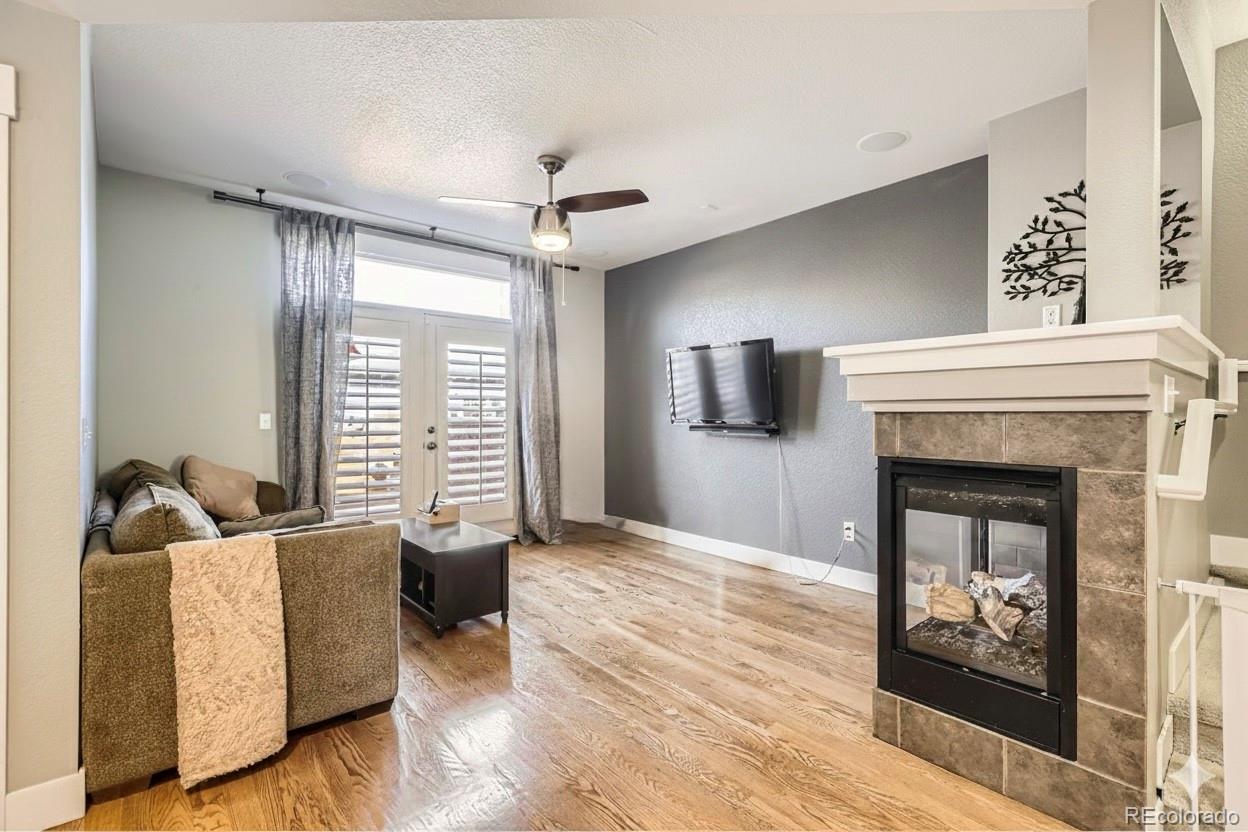 1145 South Logan Street Denver, CO 80210 - Photo 10 of 21 a living room with furniture and a fireplace