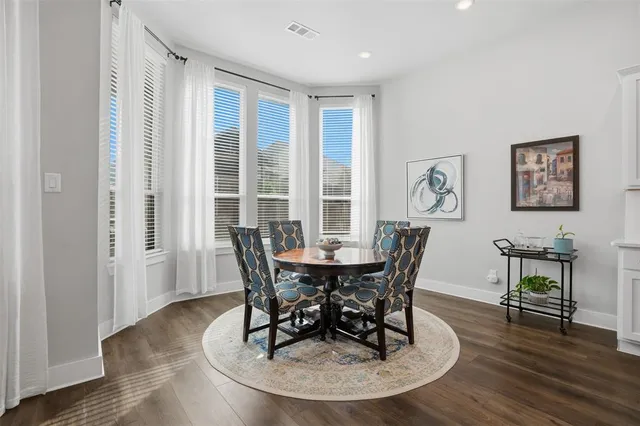 a spacious bedroom with a bed and a window