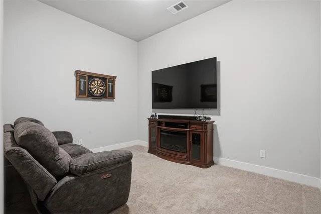 a bathroom with a double vanity sink a mirror and a bathtub