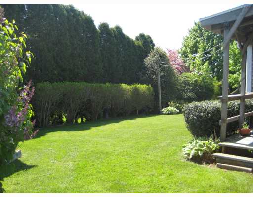 163 Ridgewood Road Middletown, RI 02842 - Photo 2 of 10 Yard/Garden. small covered deck leads to private back yard