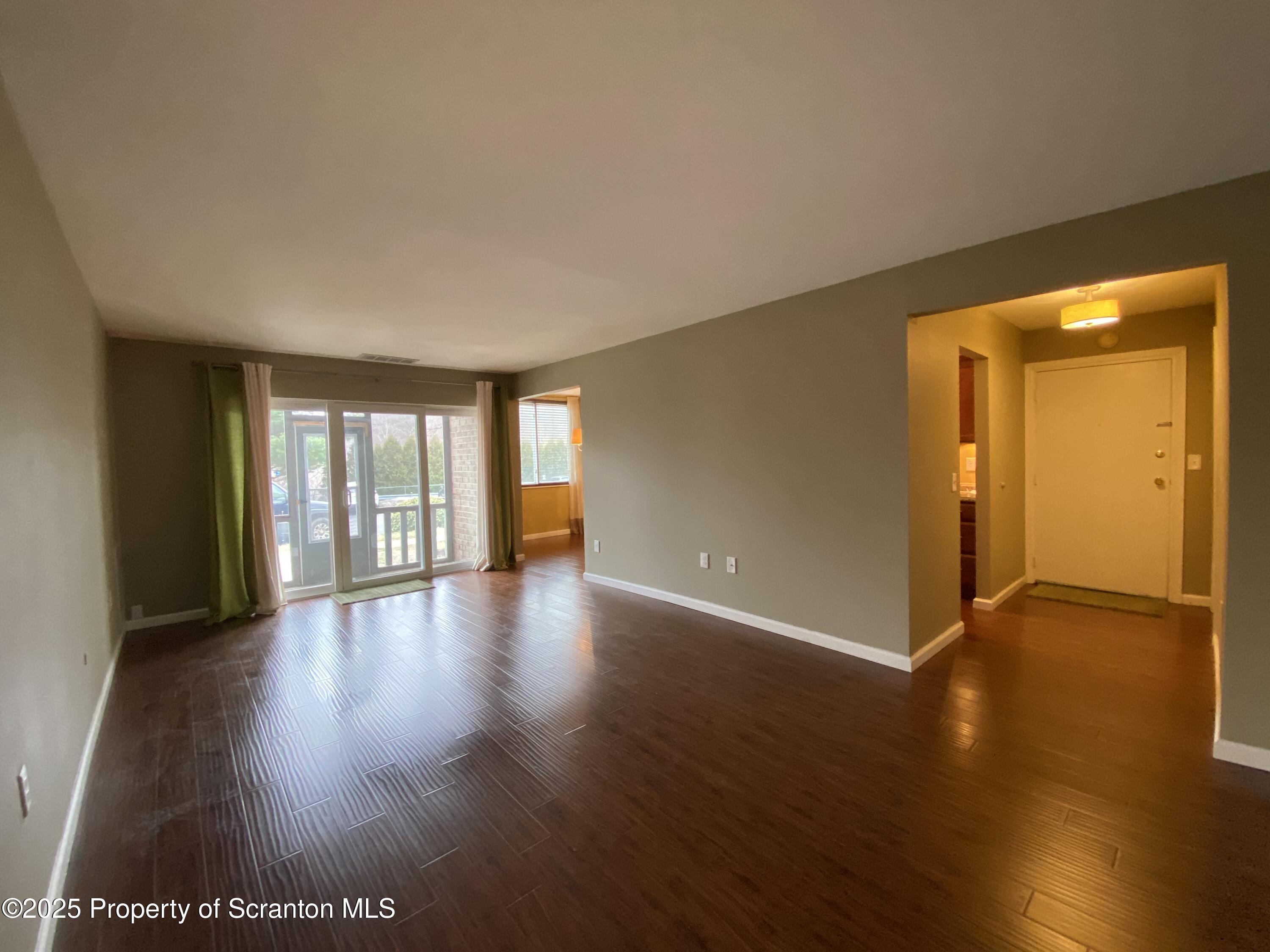 1702 Summit Pointe Scranton, PA 18508 - Photo 11 of 29 a view of an empty room with wooden floor and a window