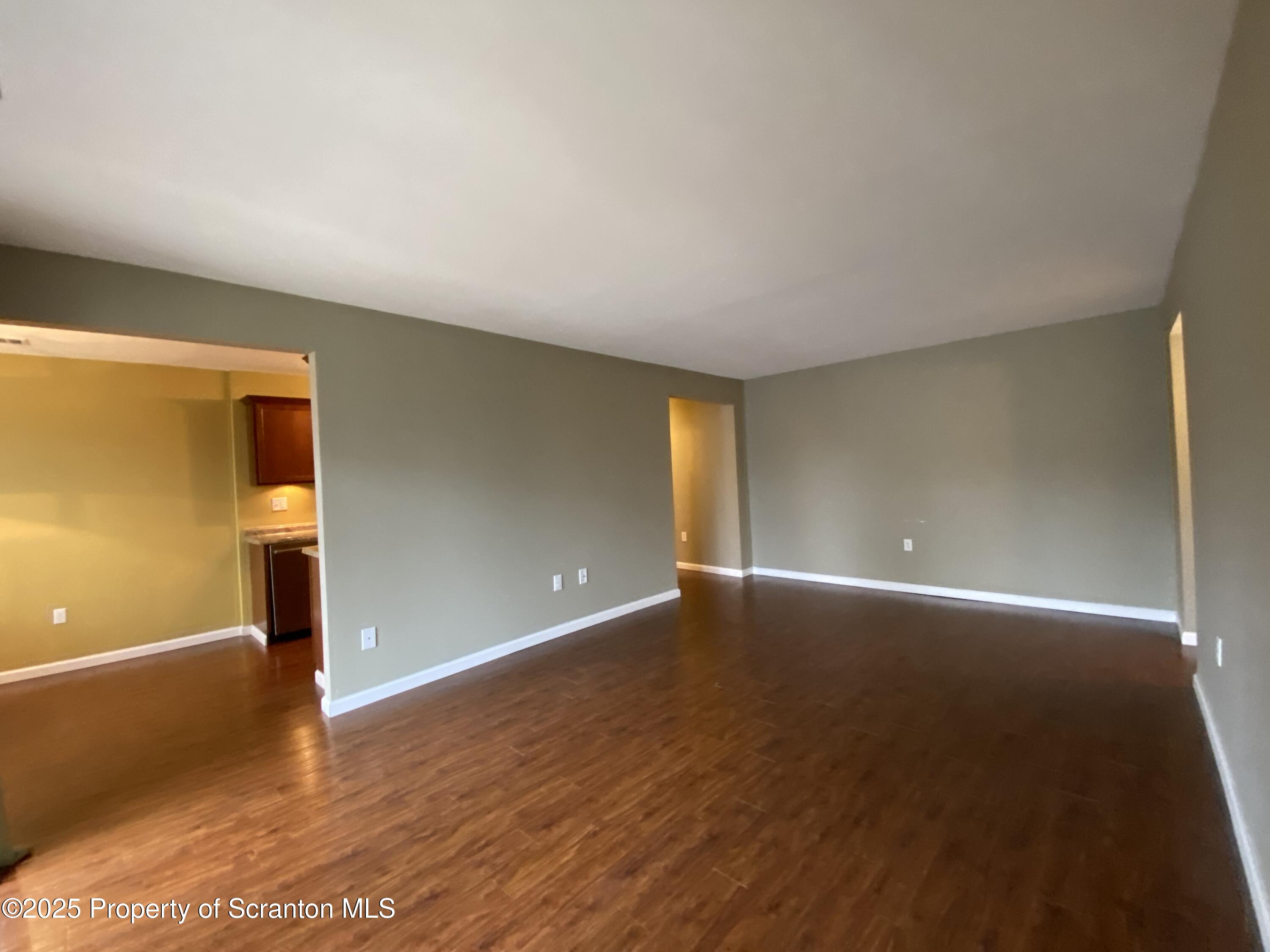 1702 Summit Pointe Scranton, PA 18508 - Photo 16 of 29 a view of an empty room with wooden floor